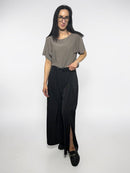 Wide cut trousers with a slit